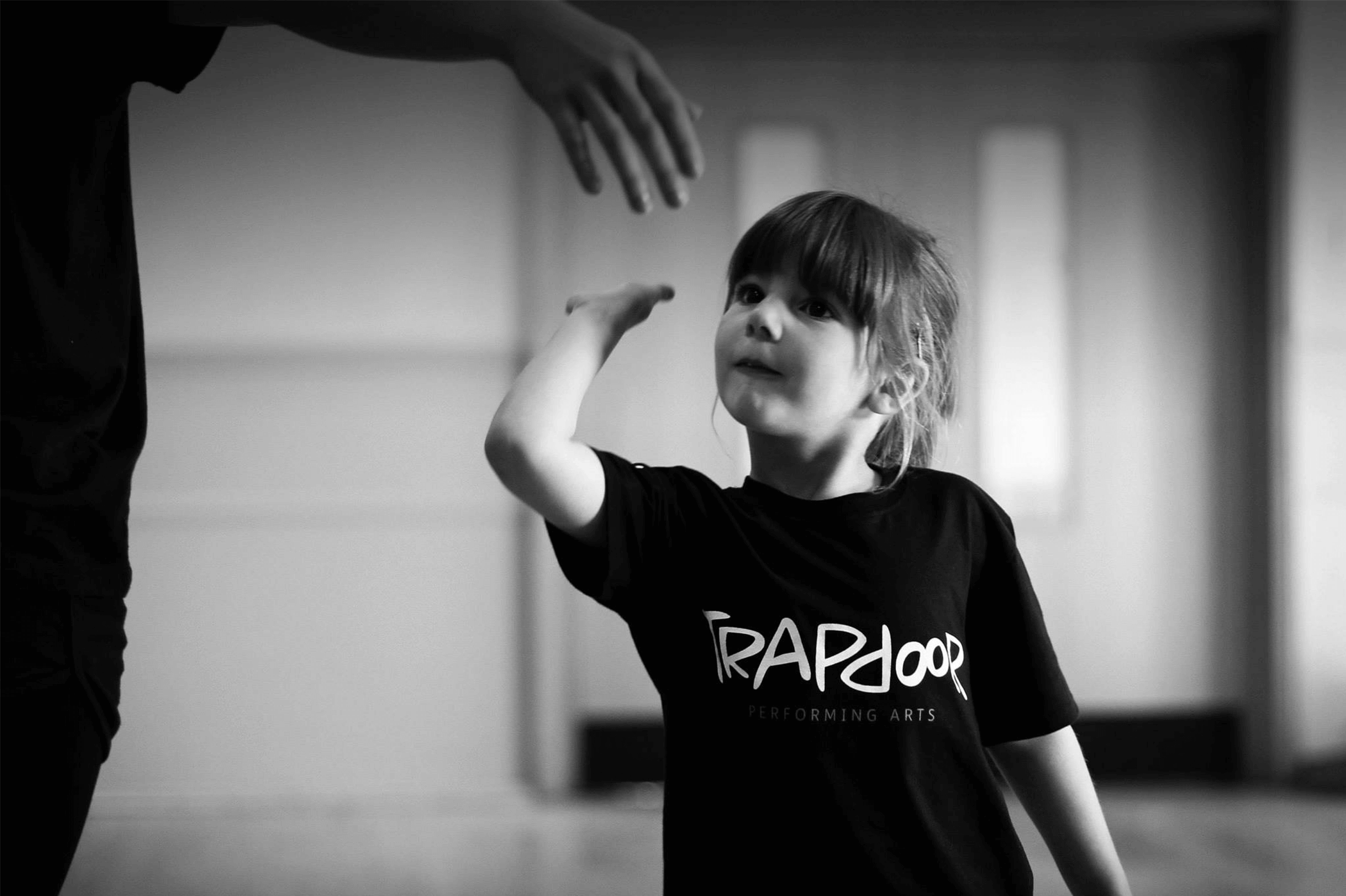 Young Girl and Teacher high-five handshake